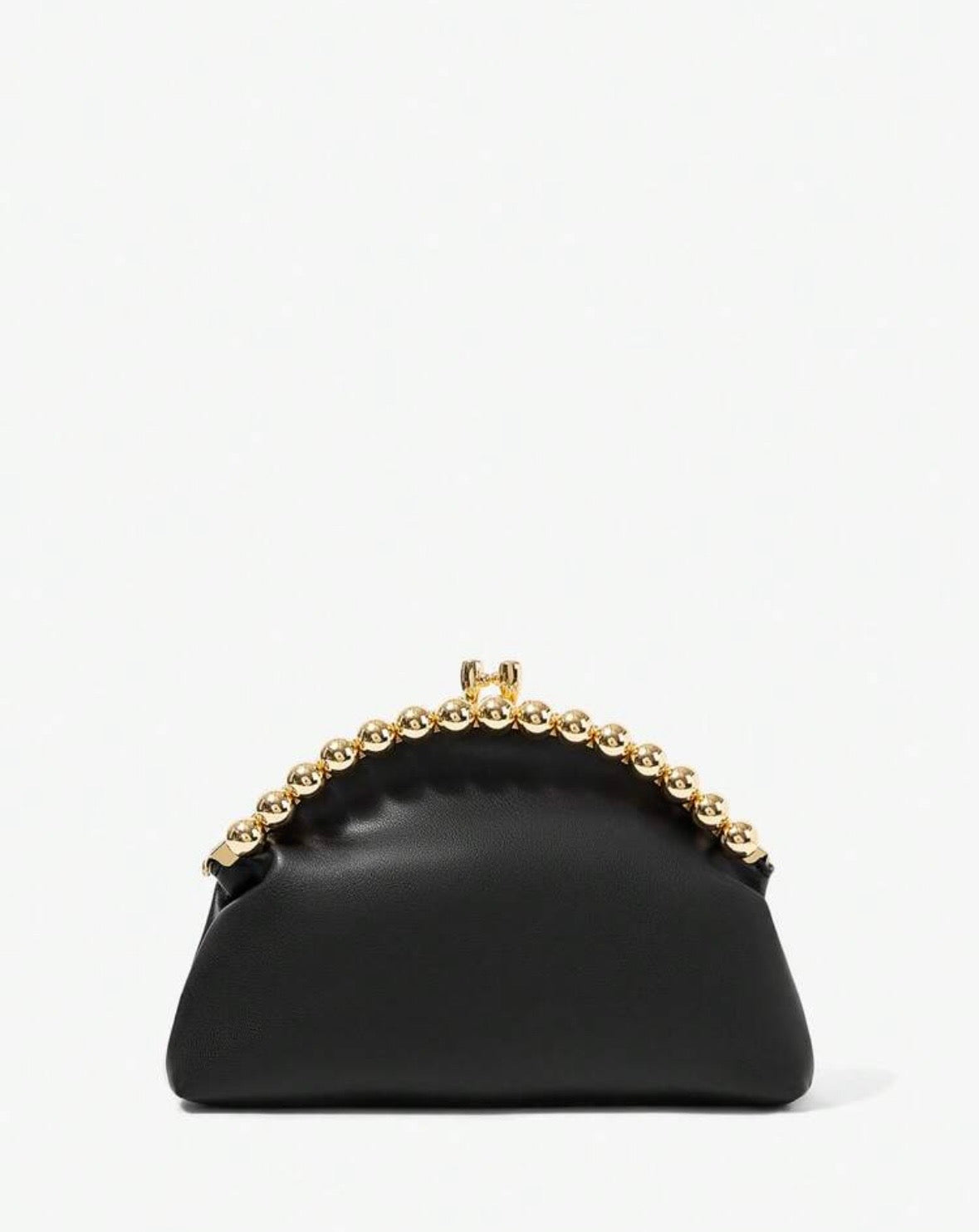 A black leather handbag with a gold-tone chain handle, photographed against a plain white background.